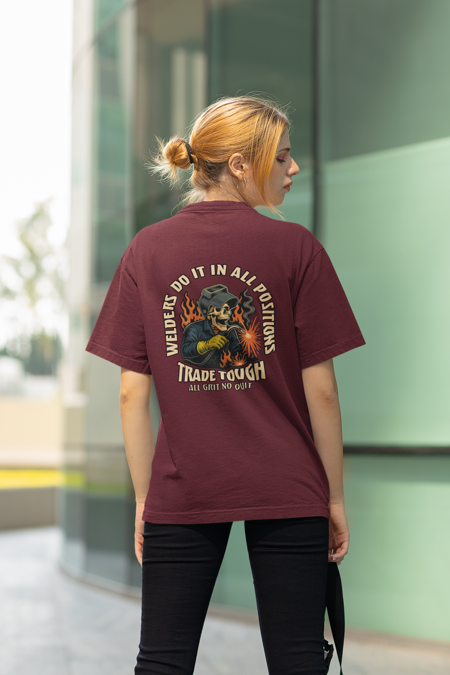 Maroon t-shirt featuring full back graphic of skeleton welder with flame background and bold slogan
