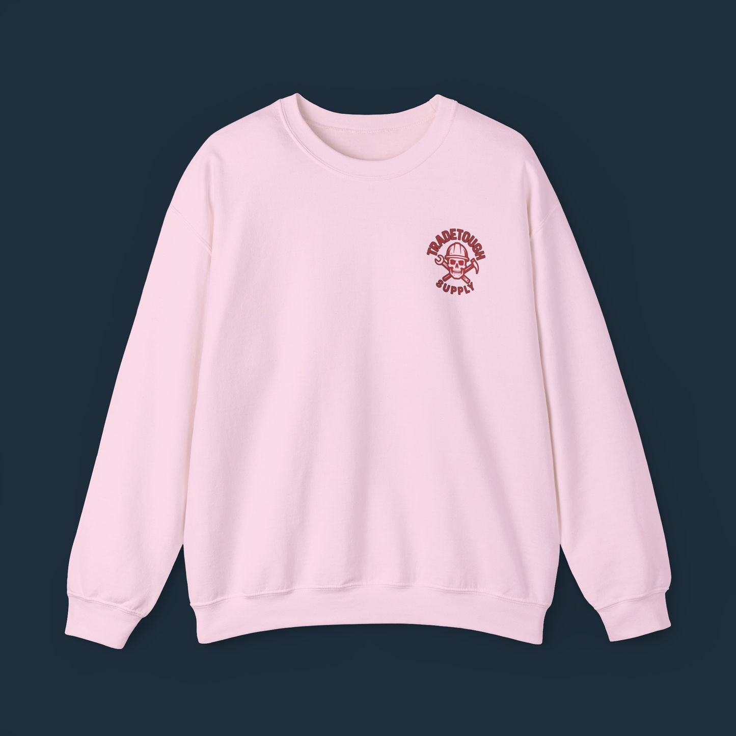 Soft pink crewneck laid flat, TradeTough chest logo visible
