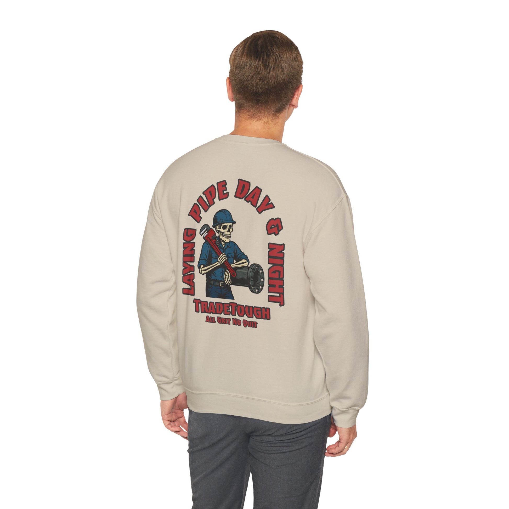 Beige sweatshirt with graphic design on the back, worn by a person on a white background