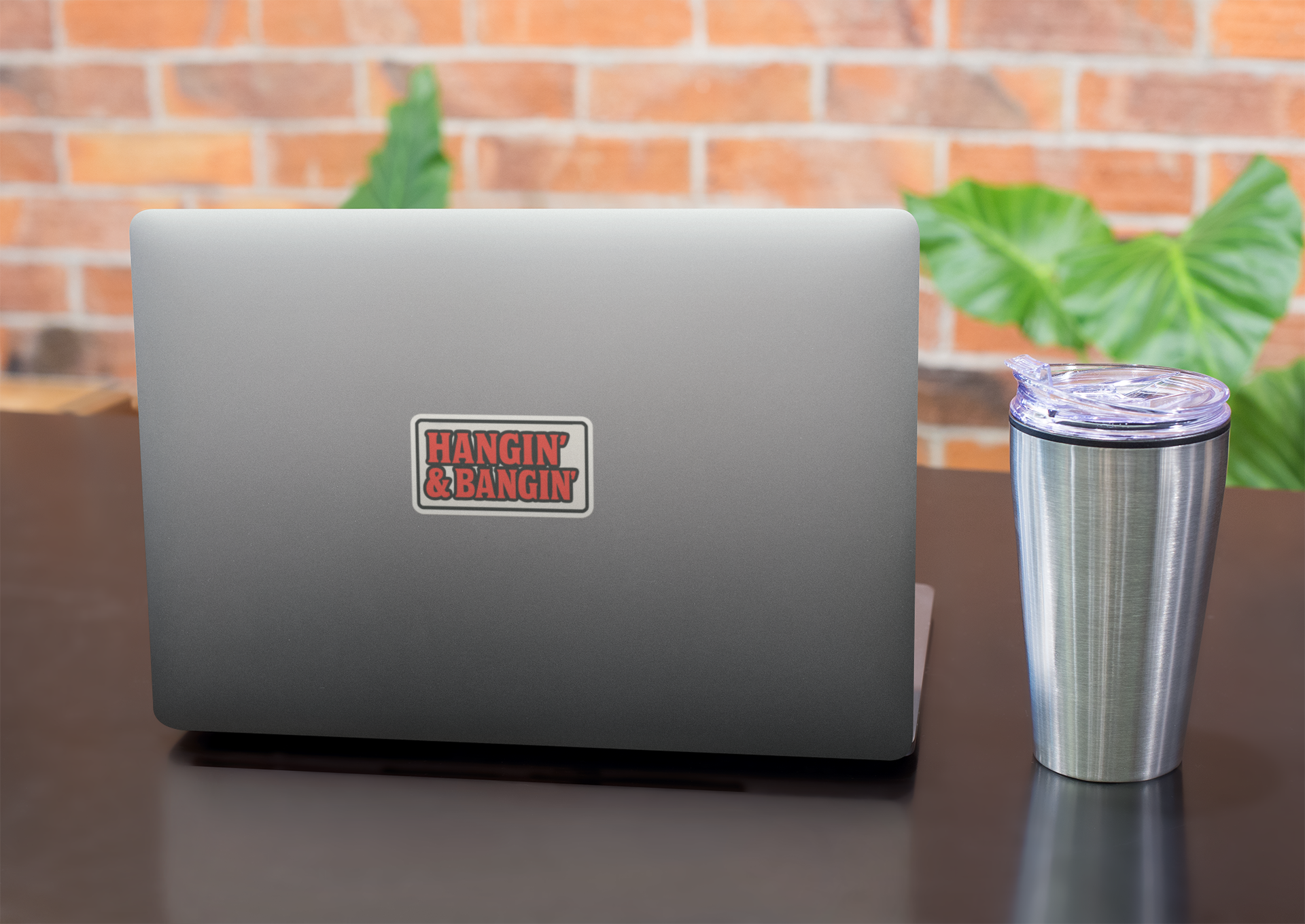 Hangin’ & Bangin’ boxed sticker on silver laptop – bold red vinyl decal with black border for tradesmen