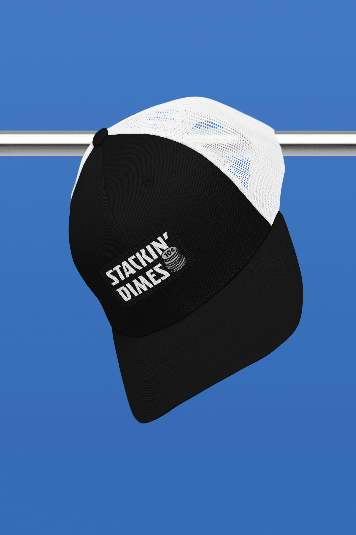 Black and white cap with 'Stackin' Dimes' text on a blue background