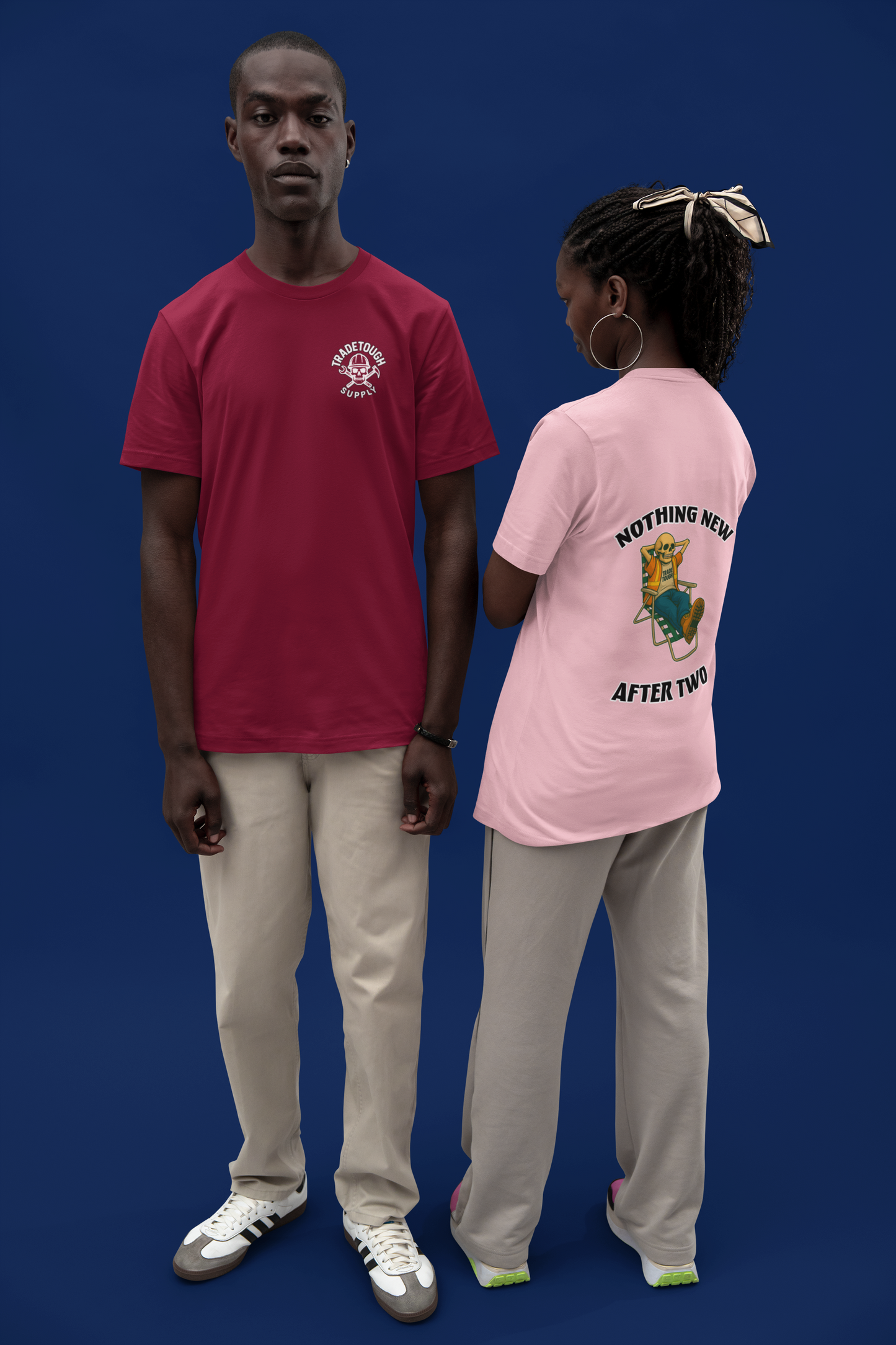 Two people wearing t-shirts with visible text and graphics against a blue background