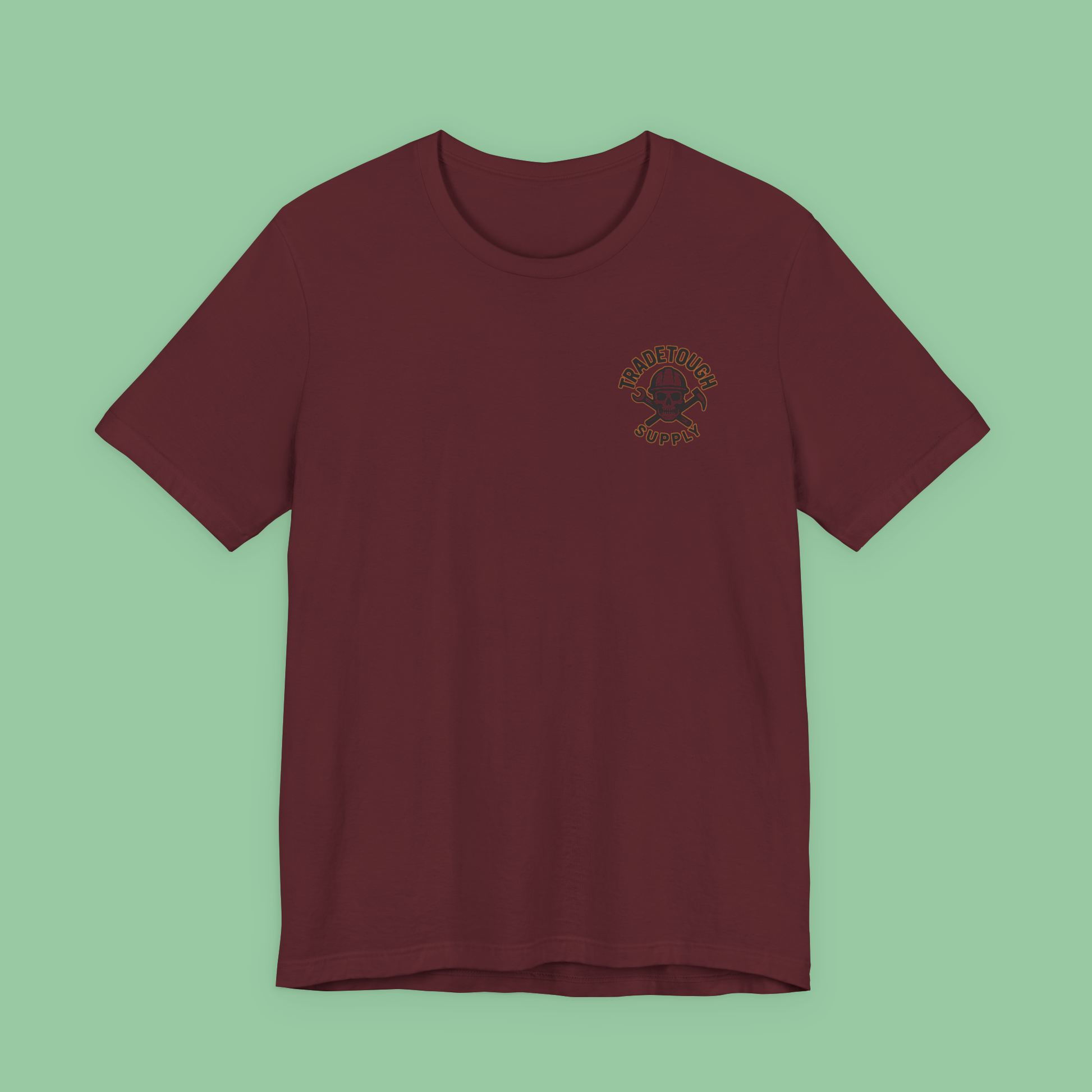 Flat lay of maroon t-shirt with front TradeTough Supply branding