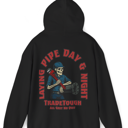 Black hoodie featuring bold skeleton pipefitter graphic and “Layin’ Pipe Day & Night” slogan