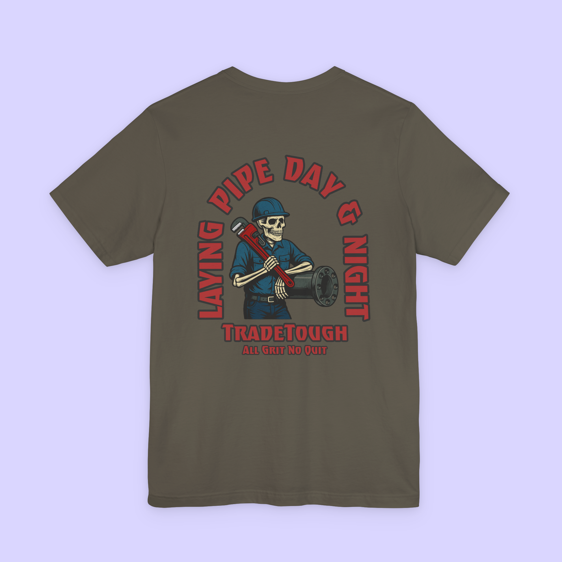 Green t-shirt with a graphic design on the back featuring a skeleton wearing a hard hat and holding pipes, with text 'Laying Pipe Day & Night' and 'Tradetough'.