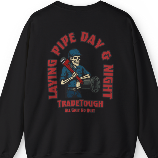 Skeleton pipefitter graphic on black sweatshirt with “Layin’ Pipe Day & Night” slogan