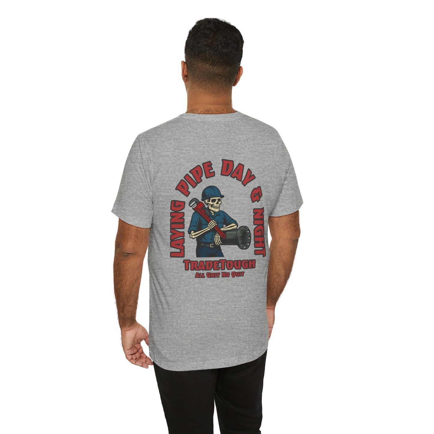 Person wearing a gray t-shirt with a graphic design on the back, featuring text and a skeleton holding a pipe.