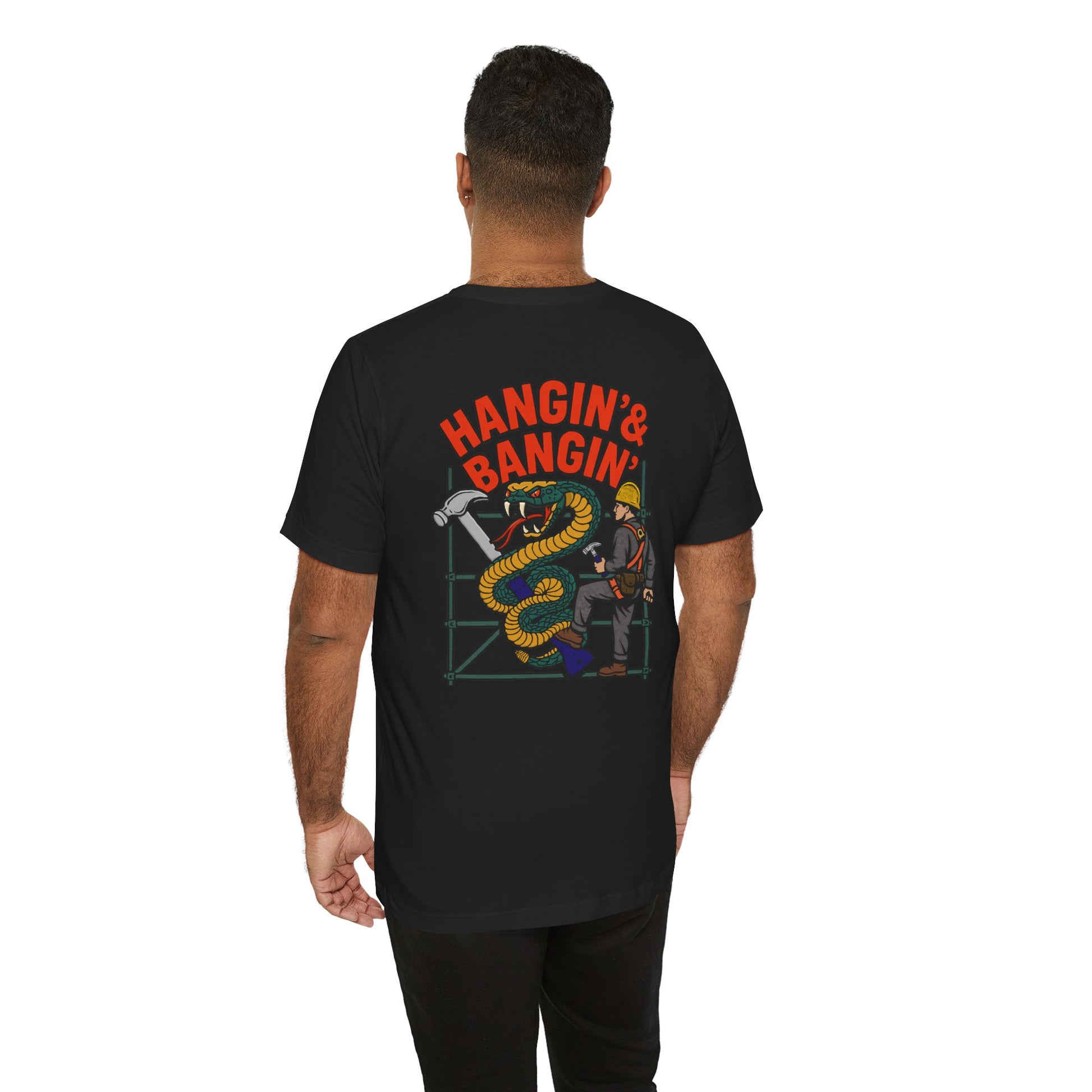 Person wearing a black t-shirt with a graphic design and text on the back, on a white background