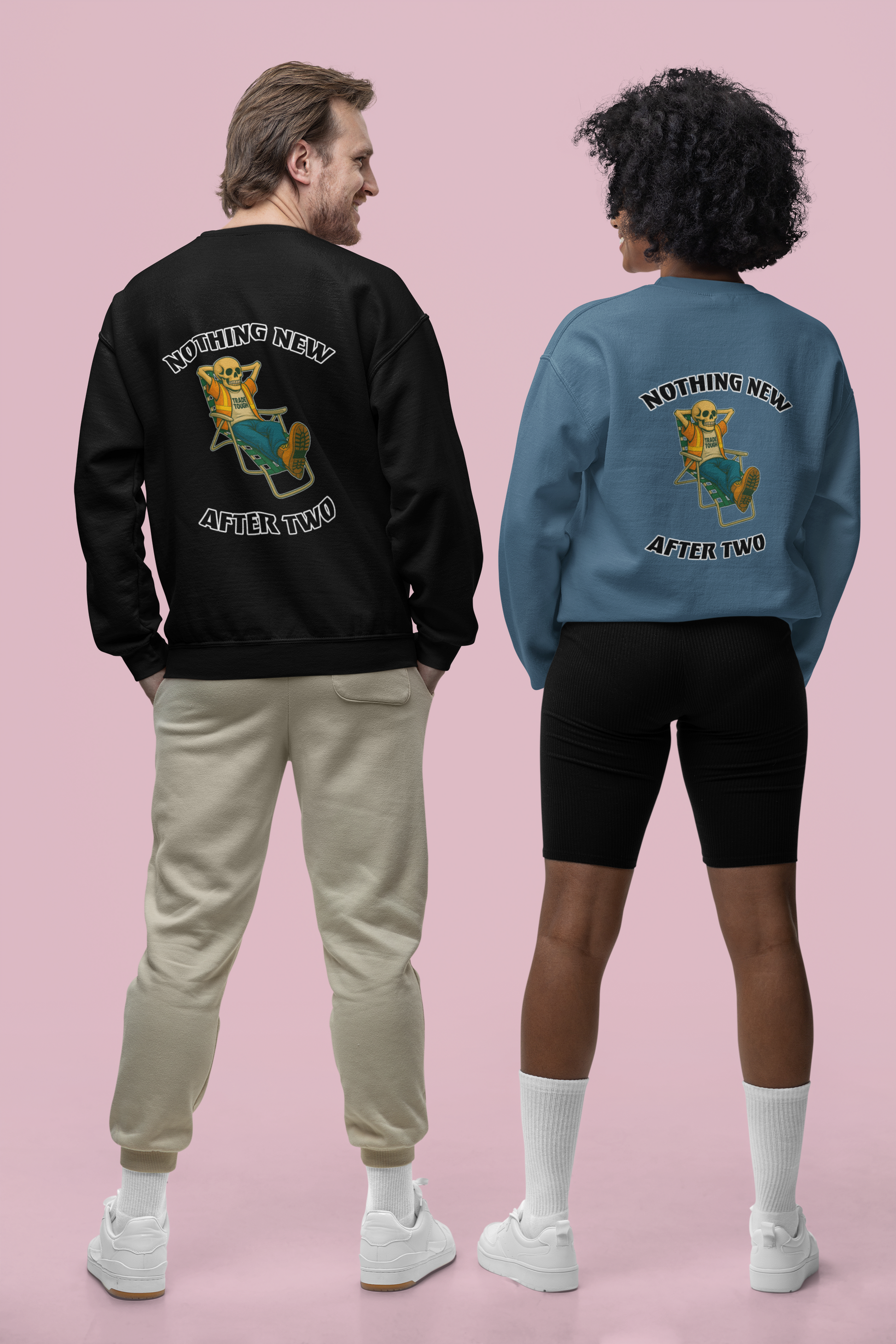 Two people wearing sweatshirts with a graphic and text on the back against a pink background